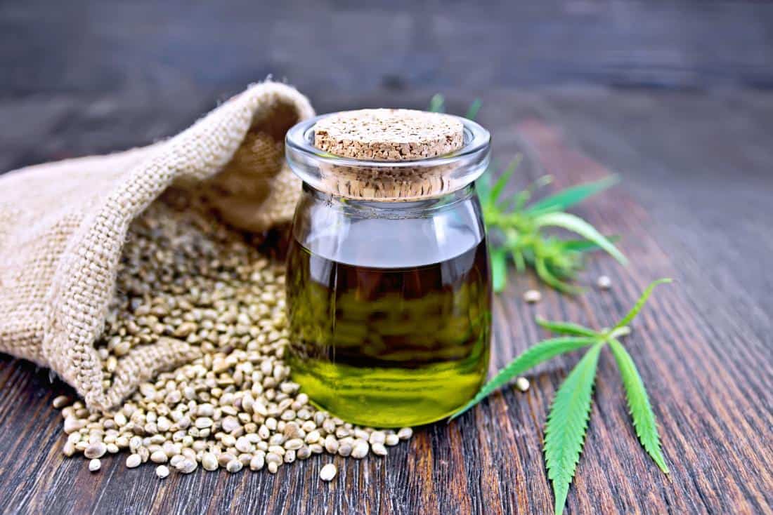 Oil in a bottle on seeds